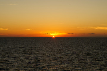 Sunset/sunrise on the ocean. Seen from a cruise