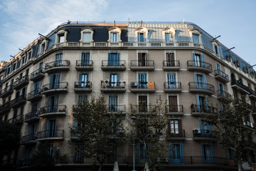 A beautiful building in Barcelona, Spain. The flag of Catalonia on the balcony. 