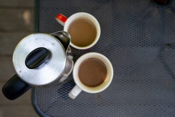 Coffee Press outside with coffee brewing in late spring on a sunny day