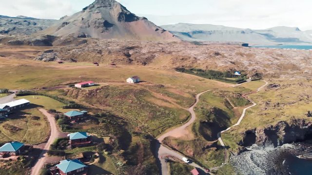 Arnarstapi coastline in sumemr season, Snaefellsnes peninsula, Iceland. Aerial view from drone