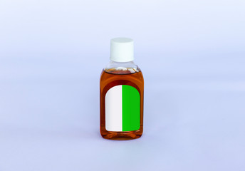 Small isolated Antiseptic Liquid bottle on a neutral background
