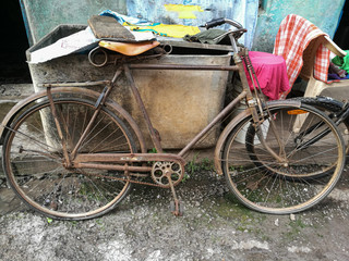 Naklejka na ściany i meble Picture of vintage and damaged bicycle