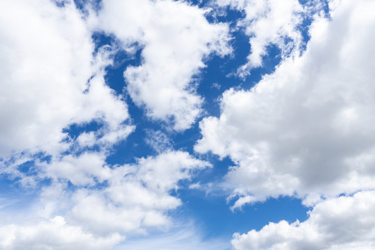 Floaty Big White Clouds Running Through The Blue Sky. Fluffy Clouds Background