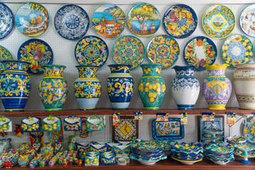 A colorful souvenir store in Vietri, Italy, selling traditional handcrafted ceramics in vivid colors. Amazing designed vases, plates and other pottery gifts