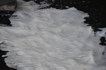 water foam in a stream