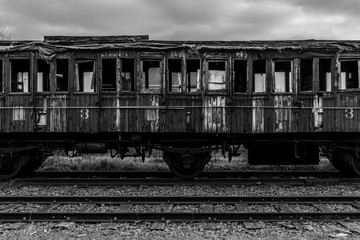 Old vintage wagon on the tracks, monochrome image