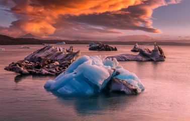 Fantastic nature of Iceland. Impressive view on aisbergs in Jokulsarlon lagoon during sunset. Amazing Icelandic seascape. popular tourist attraction. Best famouse travel locations.