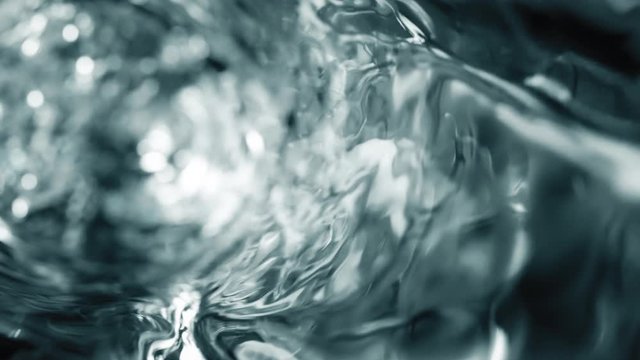 Water moves in a glass in slow motion