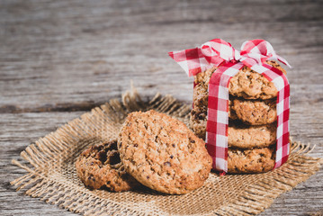 oatmeal cookies on wooden background, close-up