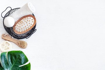 Background Spa composition for body care on a light wooden background.