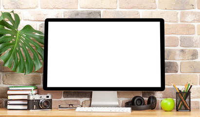 Stylish home studio workspace with computer and supplies