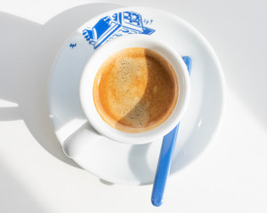 Espresso in a white cup with a blue print