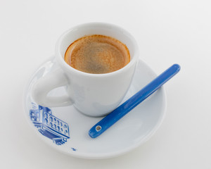Espresso in a white cup with a blue print