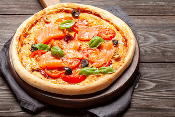 Tasty homemade seafood pizza with salmon