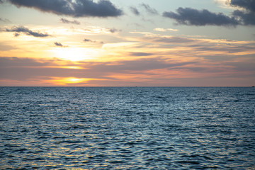 Background, beautiful multicolored sunset on the ocean