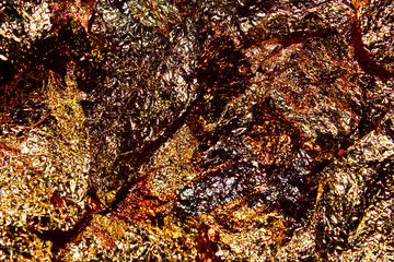 Blurry image of colorful foil texture background, horizontal view, place for text. Abstract metal wall texture background.
