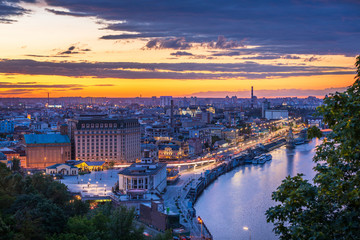 Beautiful clouds at sunset over Kyiv city with view from the Pedestrian Bridge.