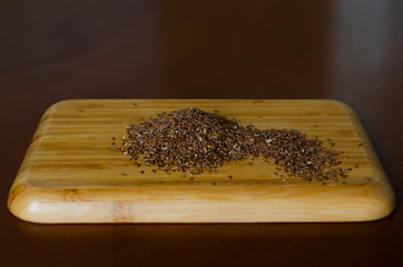 flax seeds, brown flax not on a wooden board, on the table