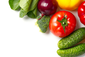 Food background border frame of colorful fresh produce raw vegetables, cucumber purple cabbage spinach tomatoes paprika onion broccoli herb, plenty of copy-space. Domestic kitchen. Vegetarian food.