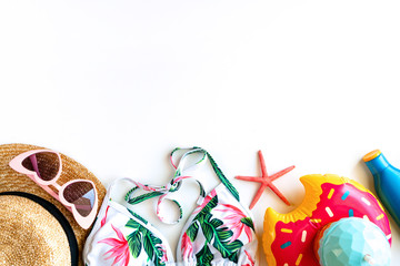 Obraz premium Flat lay of summer accessories and bikini isolated on white background, top view with copy space. Summer concept.