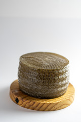 round cheese on wood white background food