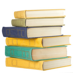 A stack of hardback books isolated on a white background close-up.