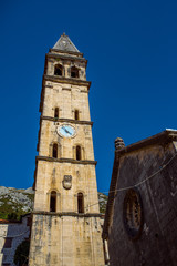 Fototapeta premium Old Church st. Eustachius Building on street old town Dobrota Kotor Montenegro trip travel summer spring