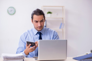 Young male employee in the office