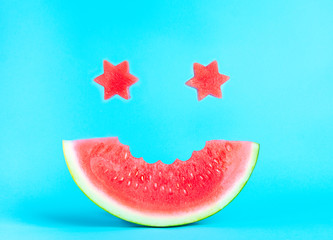A smile of watermelon on a blue background