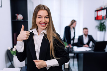 portrait of young business woman at modern startup office interi