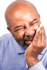African American Man having tooth ache touching cheek.  Senior with toothache. Isolated on white background
