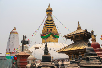 View of buddhist Swayambhunath stupa, also known among tourists as Monkey Temple, with traditional 