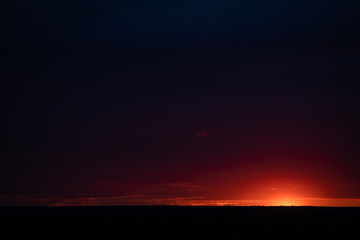 Bright sunset, clear horizon line