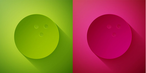Paper cut Bowling ball icon isolated on green and pink background. Sport equipment. Paper art style. Vector