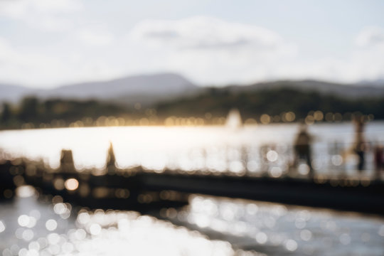 Blurred image of pier and the beautiful Lake Windermere in the evening at Lake District, UK