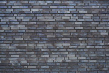 Close-up of a modern blue-gray brick wall
