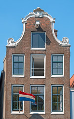 Fototapeta na wymiar Medieval facades at the Prinsengracht in Amsterdam Netherlands at Kingsday