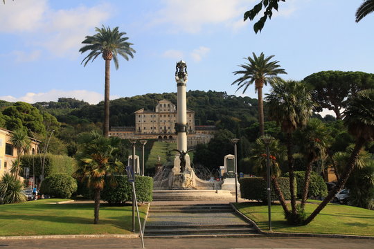 Monument in palms garden view. Italian city Frascaty park