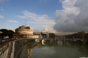 ancient Italian bridge with river in the center of Rome