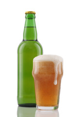 Glass and bottle of beer isolated on white
