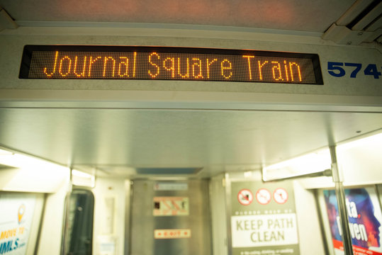 New York, NY - May 16 2020: The Path Train going from New Jersey to NYC sign saying via hoboken stopping at Journal Square 