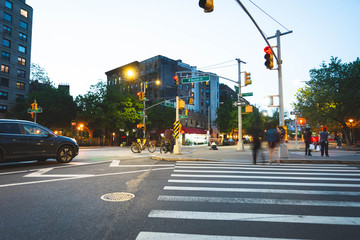New York, NY - May 16 2020: Long exposure shot of a bench and street in Houston Street in NYC during nighttime © Devajyoti
