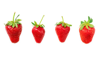 Four different big ripe red strawberries laying on isolated white background