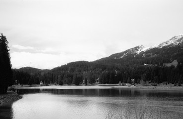 The lake of Lenzerheide on the Swiss Alps and the  empty lake promenade during the Covid-19 lockdown