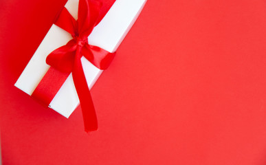 pink office desk with smartphone with blank screen mockup, laptop computer, cup of coffee and supplies. Top view with copy space, flat lay.
