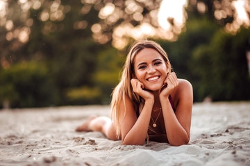 Portrait of a cheerful girl on a beach. Summer vacation concept.