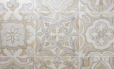 Beige porcelain tiles with ornament. Background and texture of porcelain tiles.