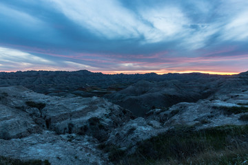 Fototapeta na wymiar Landscape view of a colorful sunset in Badlands National Park in South Dakota).