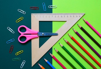 Flat composition of School stationery on a colorful background. The view from the top.
