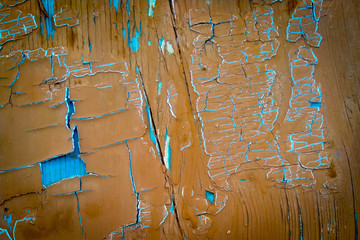 old craced yellow paint on a door with white gaps. texture, background